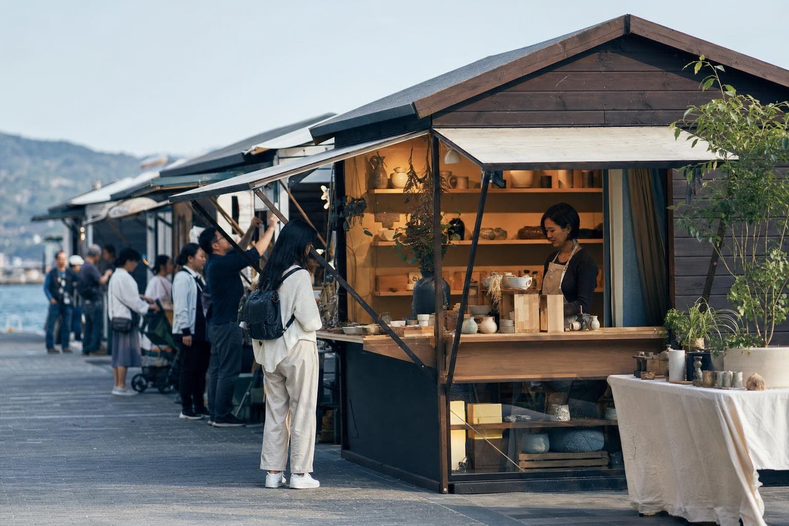 A photo of one distinctive market stall clearly standing apart from identical neighboring stalls.