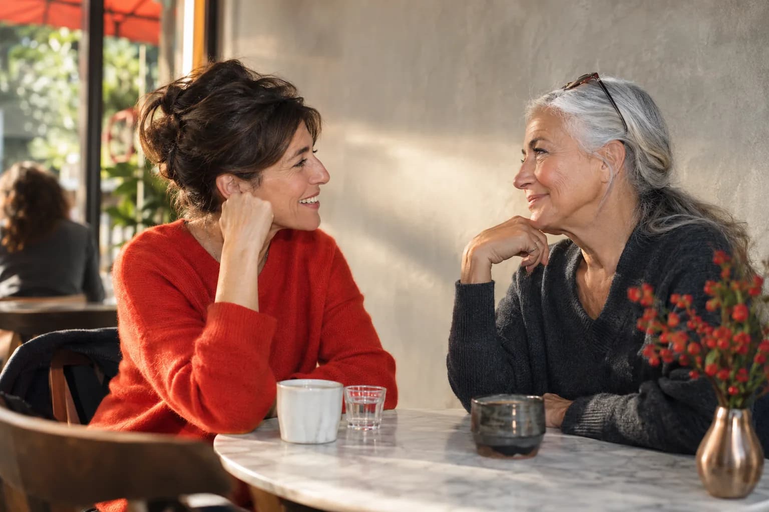 Two adults sharing a conversation in a bright cultural space