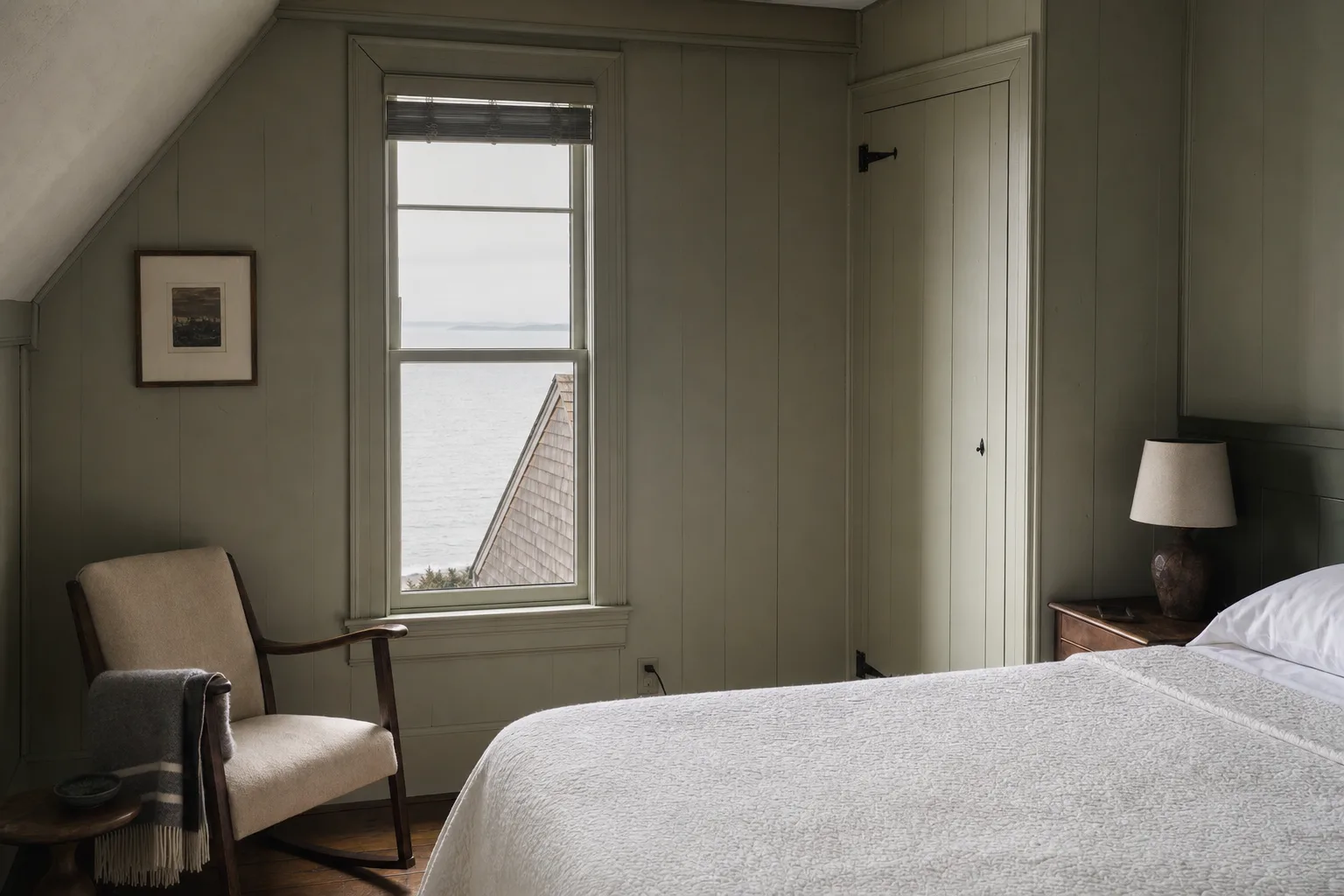 Fog Bell — quiet room with a sideways glimpse of the sea