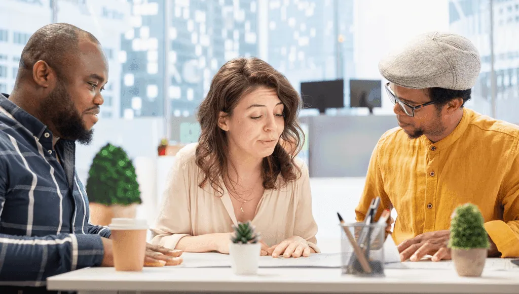 Team discussing a project around a table
