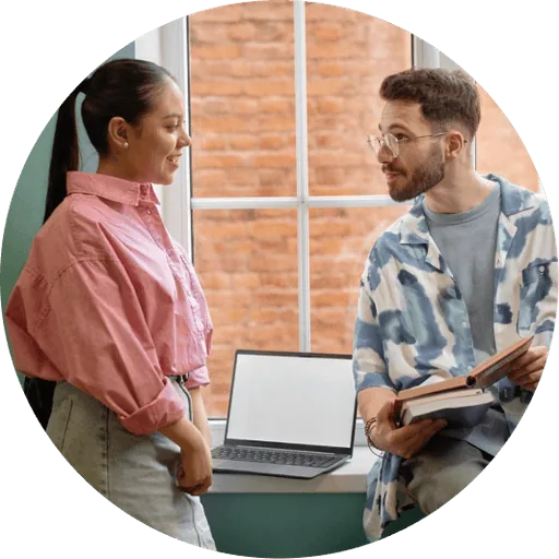 Two colleagues reviewing a printed report together