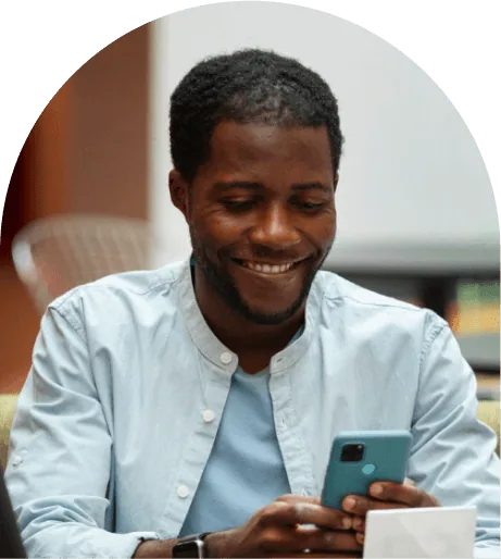 Founder smiling during a phone call