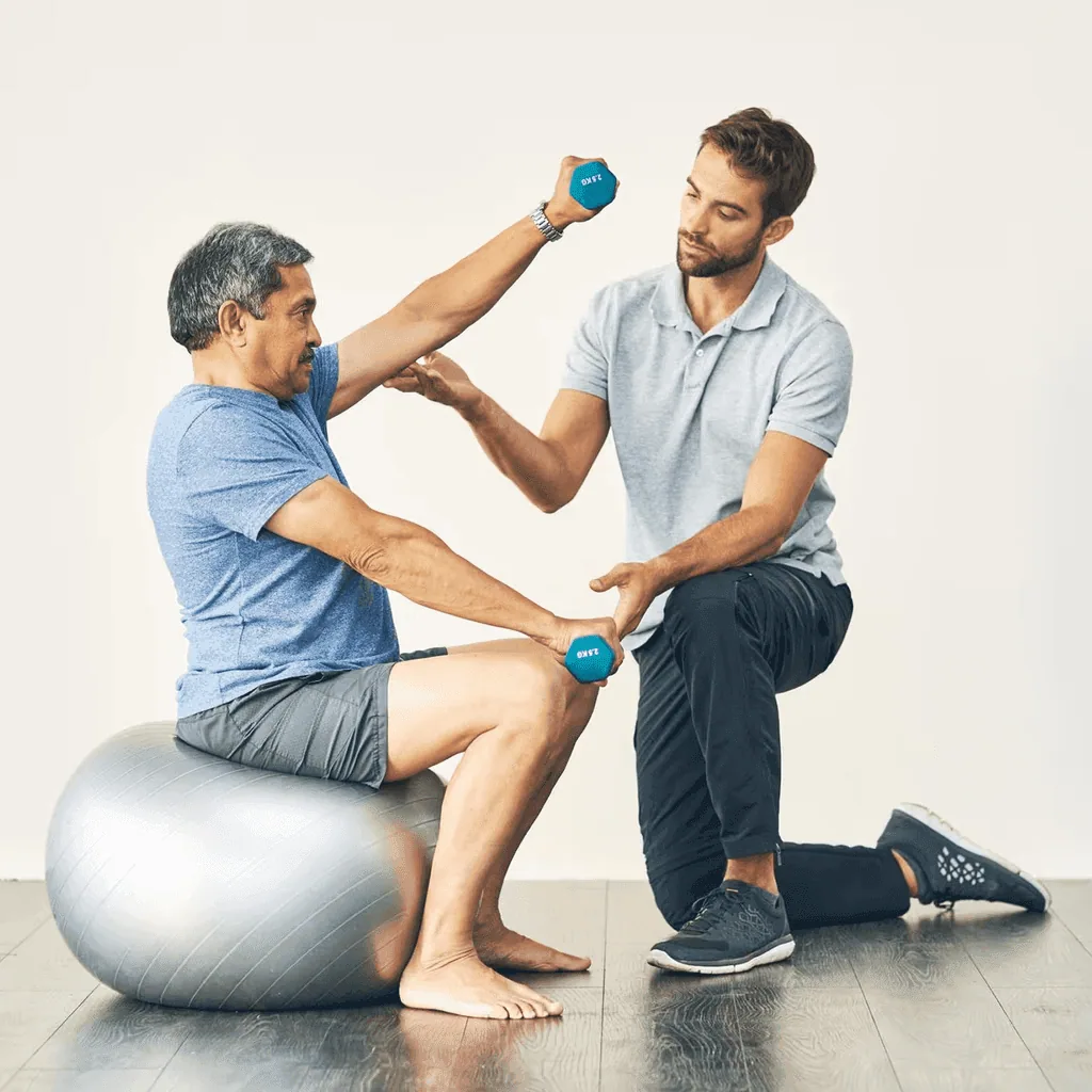 A client working through a guided mobility exercise on the floor