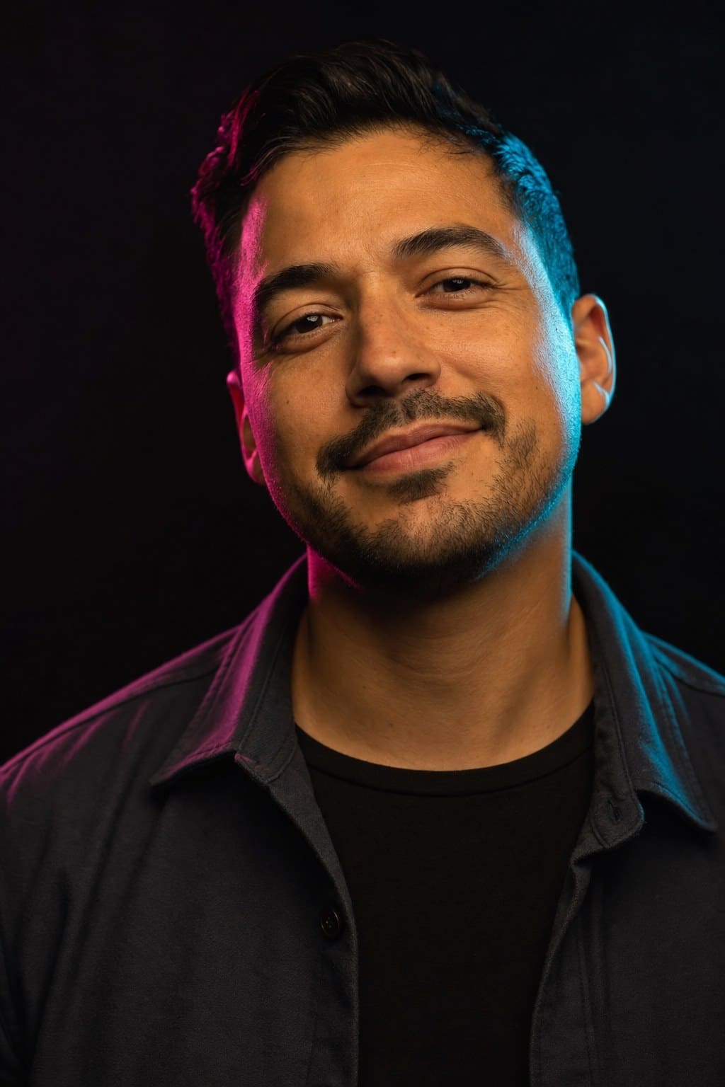 Marco Reyes, bartender and ice cutter, lit by the back bar
