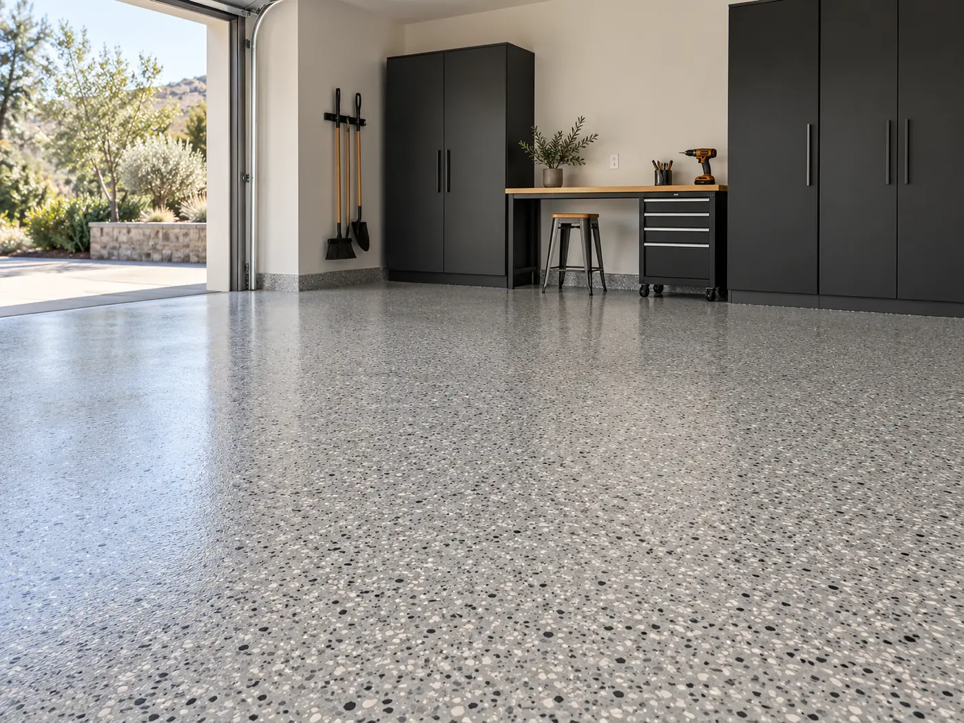 Daylit garage with a finely textured grey flake floor and clean finished edges.
